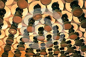 Group of pattern of old vintage storm lanterns, hurricane lamp hang on ceiling wood.