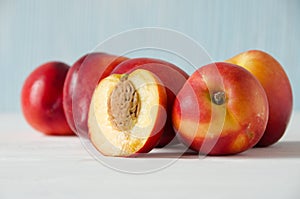 Group of peaches wooden background