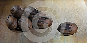 Group of pecans on a wood table