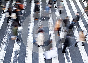 Group of pedestrians crossing the street