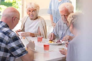 Pensioners eating lunch photo