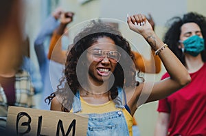 Group of people activists protesting on streets, BLM demonstration and coronavirus concept.