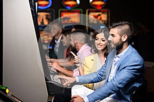 Group of People at Automat Machine in Casino