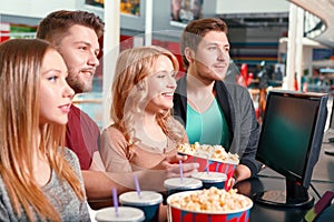 Group of people buying popcorn and coke