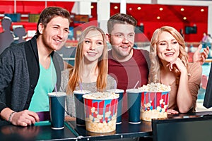 Group of people buying popcorn and coke