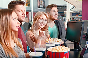 Group of people buying popcorn and coke