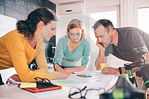 Group of people checking blueprints