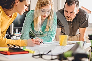 Group of people checking blueprints