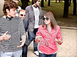 Group of people in city park.