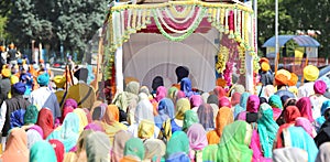 group of people with colorful clothes and women with veil in the