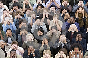 Group Of People Covering Eyes With Hands