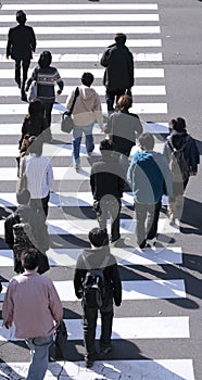 Group of people crossing the street