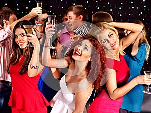 Group people dancing at party.