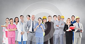 Group of people with different professions standing in front of blank grey background