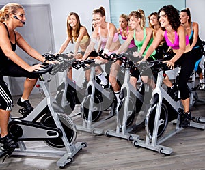 Group of people doing exercise on a bike