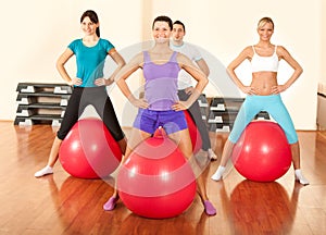 Group of people doing exercises in a gym