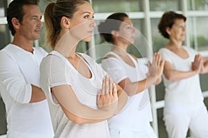 Group of people doing yoga and relaxing