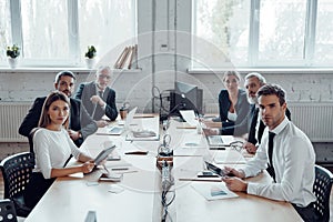 Group of people in elegant formalwear photo