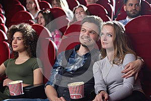 Group of people enjoying movie at the cinema