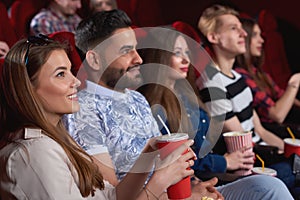 Group of people enjoying movie at the cinema