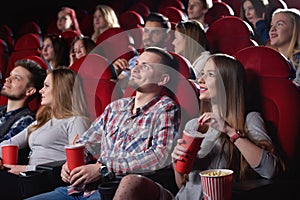 Group of people enjoying movie at the cinema