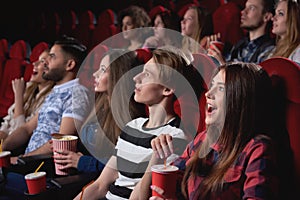 Group of people enjoying movie at the cinema