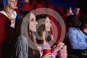 Group of people enjoying movie at the cinema