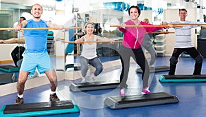 Group of people exercising in a fitness club