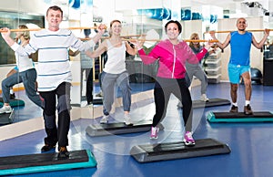 Group of people exercising in a fitness club