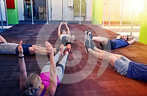 Group of people exercising in gym