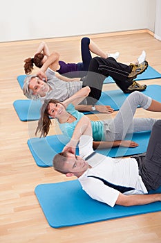 Group of people exercising in a gym class