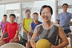 Group of people exercising in the gym, portrait