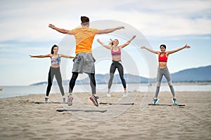 Group of people exercising together; Healthy lifestyle concept
