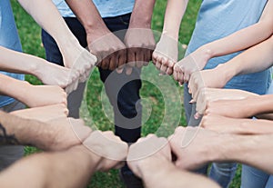 Group of people fist bump assemble together