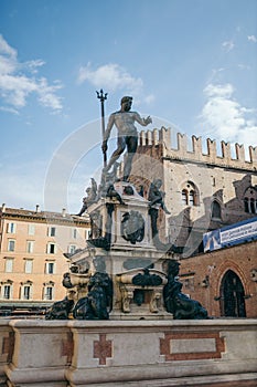 A group of people in front of Fountain of Neptune, Bologna