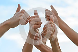Group of people giving thumbs up