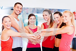 Group of people in the gym celebrating victory