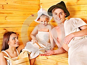 Group people in hat at sauna.