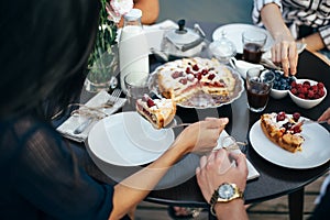 Group of people having breakfast together