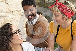 Group of people having fun together at cafe bar outdoor. Spring, warm, togetherness, lifestyle, diversity concept