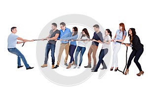 Group of people having a tug of war photo