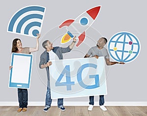 Group of people holding 4G technological icons