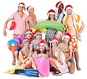 Group people holding beach accessories.