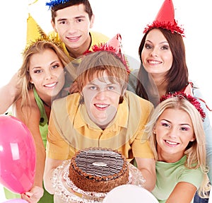 Group people holding cake.