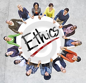 Group of People Holding Hands Around Letter Ethics photo