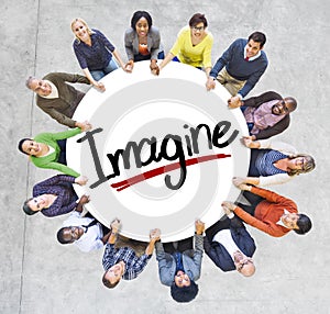 Group of People Holding Hands Around Letter Imagine