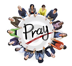 Group of People Holding Hands around Letter Pray