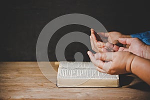 Group of people holding hands praying worship believe