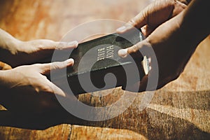 Group of people holding hands praying worship believe