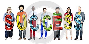 Group of People Holding Letter Success